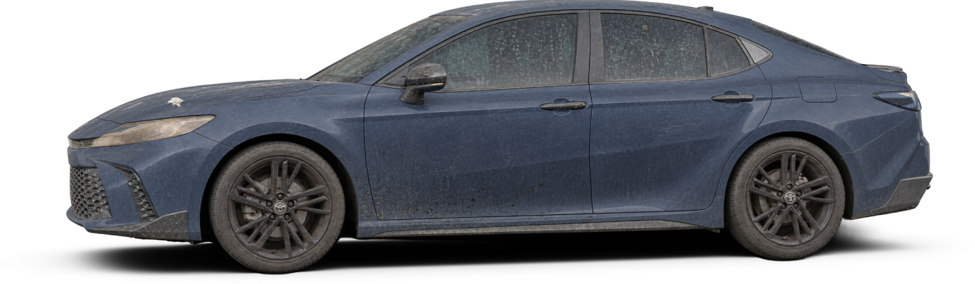 A neglected Cosmos Blue Toyota Camry, side view
