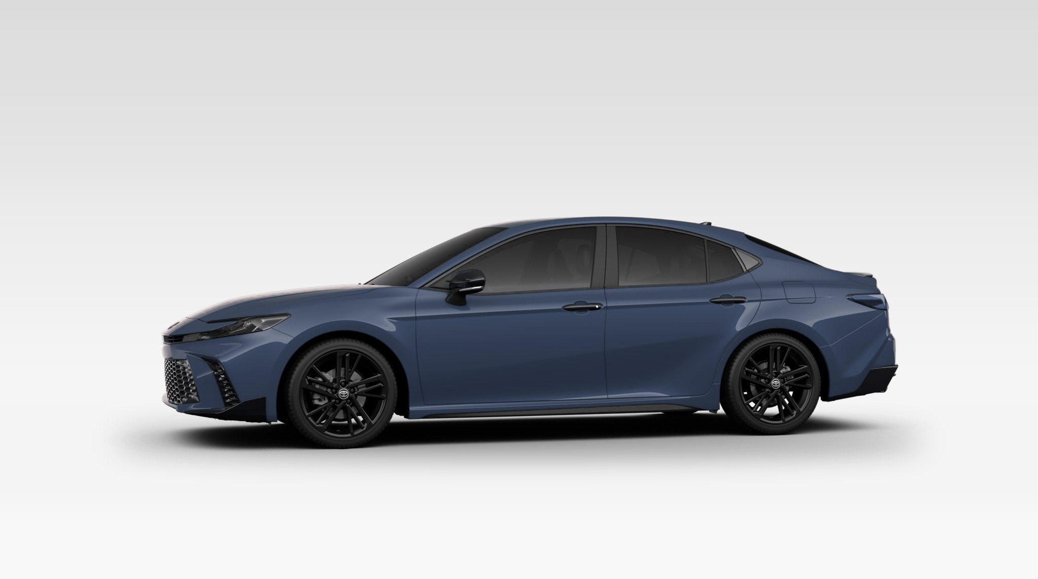 A clean Cosmos Blue Toyota Camry.